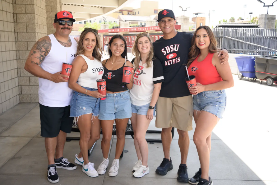 Photo of family outside of Viejas Arena before New Student and Family Convocation