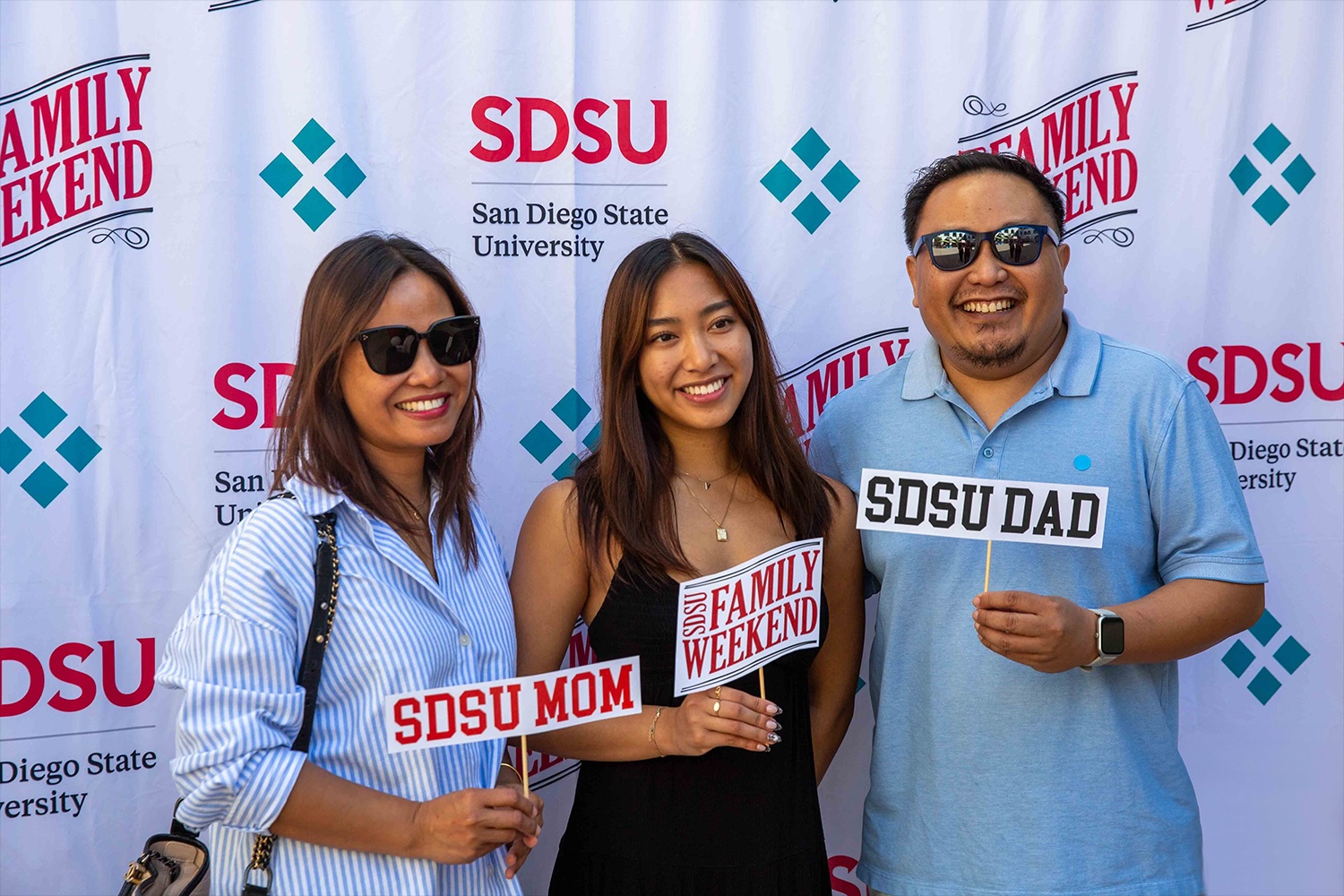 family in front of family weekend background